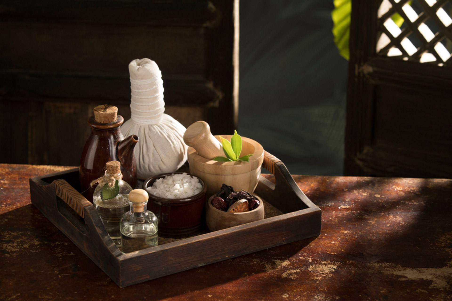 Traditional Ayurvedic treatment room with herbal oils at Vydyans Ayurveda in Vylathur, Kerala