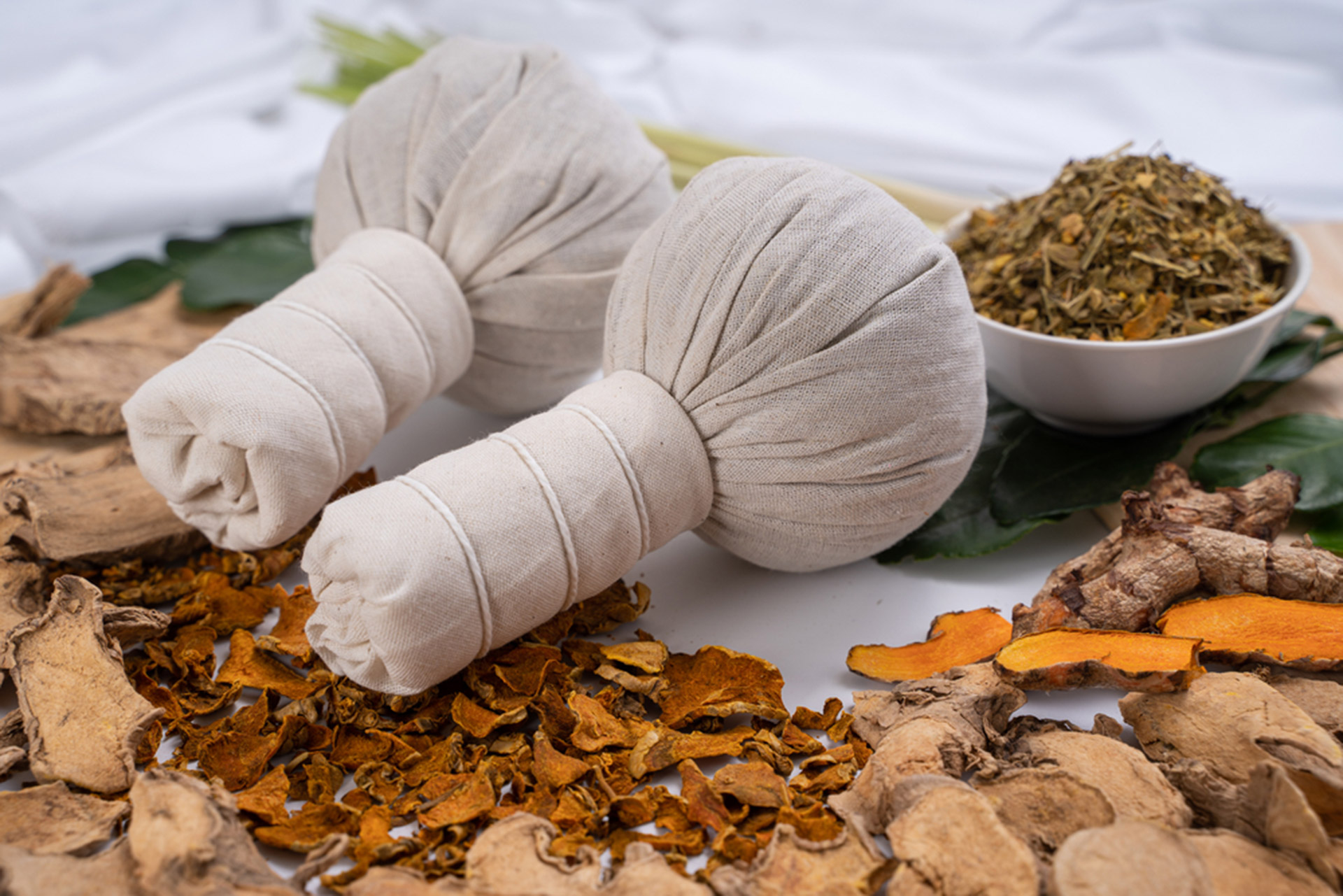 Kizhi Ayurvedic therapy using herbal poultice at Vydyans Ayurveda clinic in Vylathur, Kerala